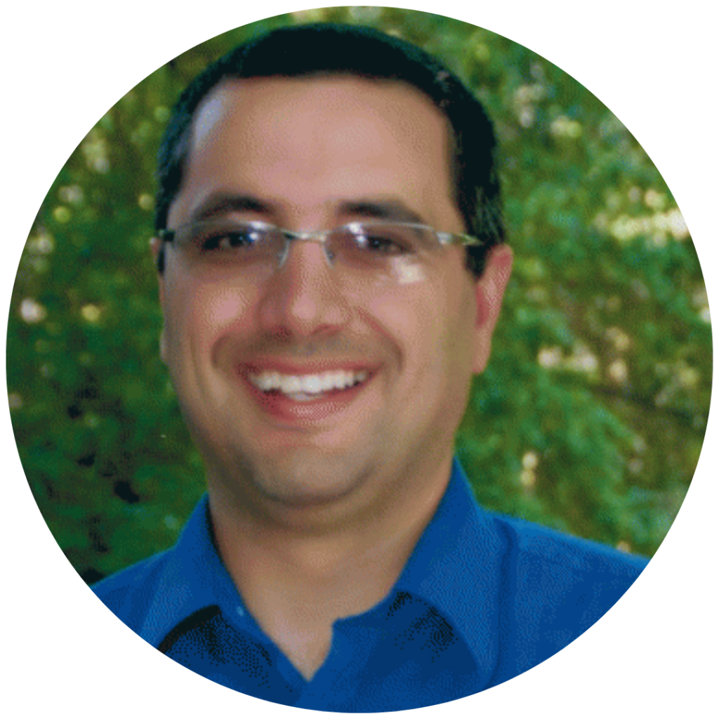 Smiling person wearing glasses outdoors