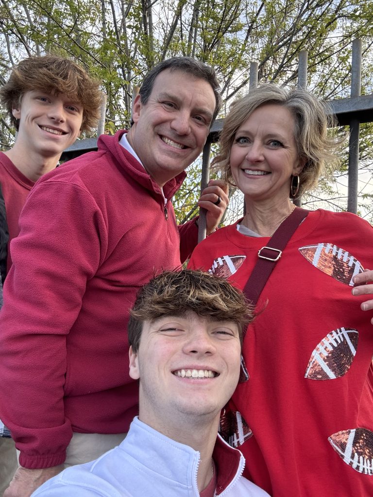 Family smiling together outdoors