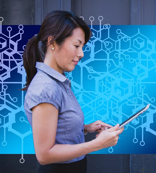 Woman using tablet with tech background