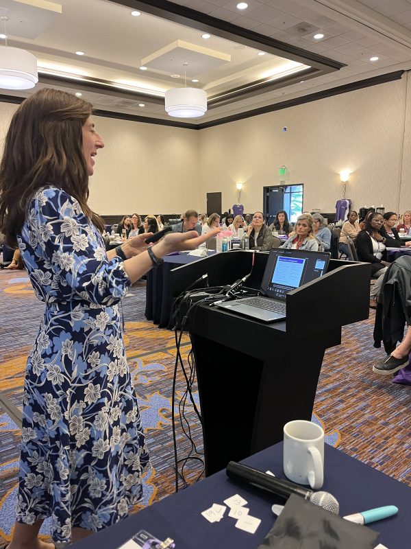 Woman speaking at a conference.